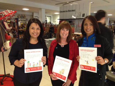 Wake-up rally with Macy's associates, Yesenia and Marie, store managers, to cheer on everyone to sell coupons for RIF. The more coupons, the more books equals happy kids reading!